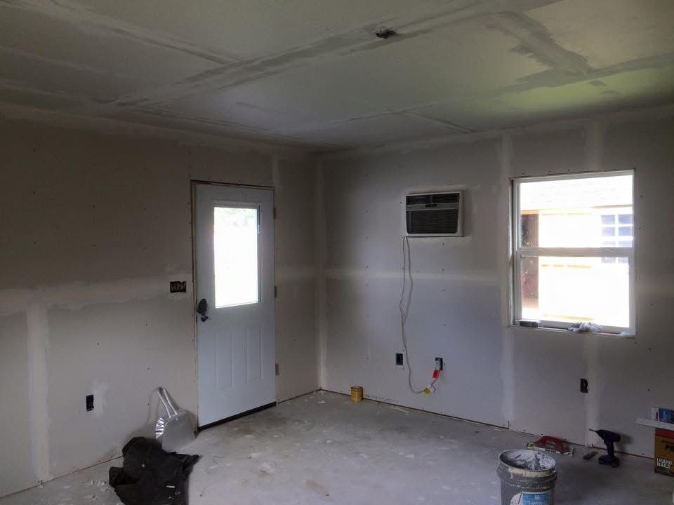 Drywall taped and mudded in a new room