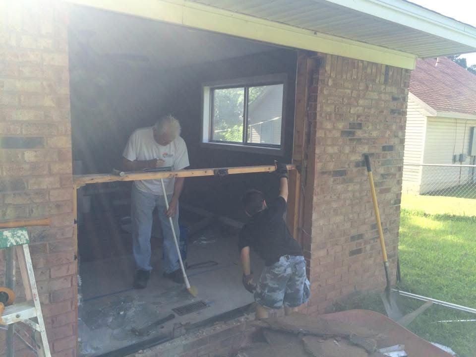 Patriot crew widening a brick opening for new doors