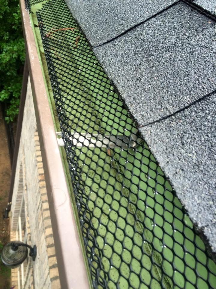 Close-up of mesh gutter guard on a gutter